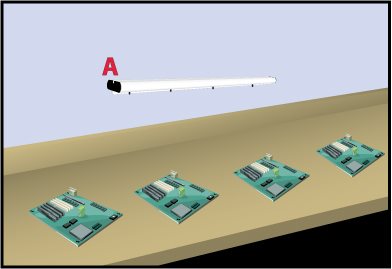 Technician assembling an electronic circuit at an ESD-controlled workstation